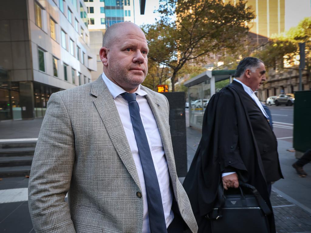 Nick Stevens leaves County Court with his lawyer Jim Stavris. Picture: David Caird