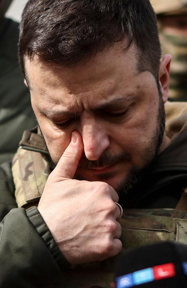 Volodymyr Zelenskyy is emotional as he walks through the town of Bucha. Picture: AFP