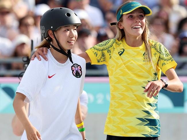 Covell congratulates gold medal-winner Coco Yoshizawa, from Japan, at the Olympics. Picture: Adam Head