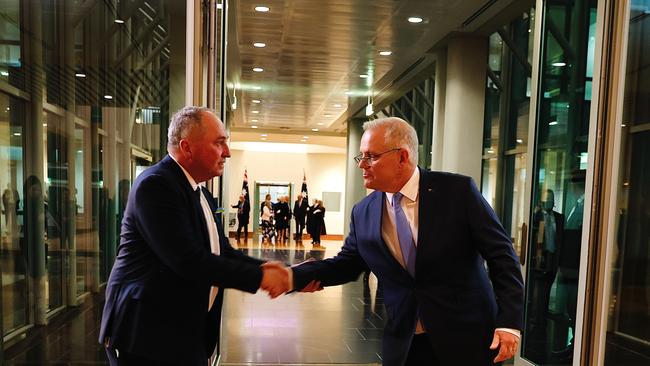 PM Scott Morrison and deputy Barnaby Joyce shake hands at the Federal Budget announcement 2022, March 29, 2022. Picture: Brad Hunter