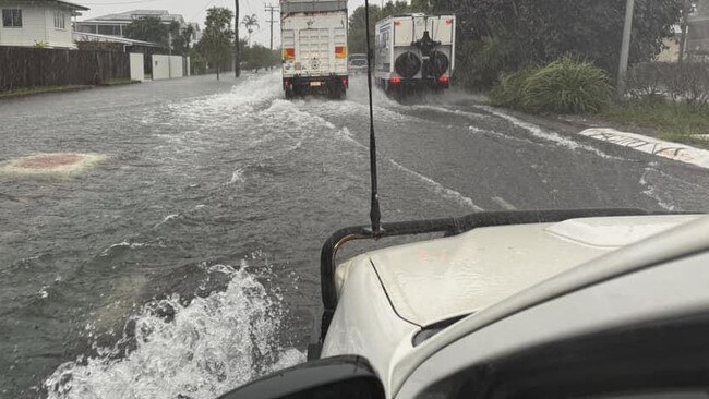 Drivers attempt to get through flooded streets in Cairns. Picture: Facebook.