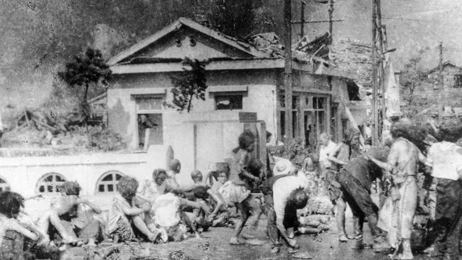 Survivors of the first atomic bomb ever used in warfare await emergency medical treatment in Hiroshima on August 6, 1945. Picture: AP