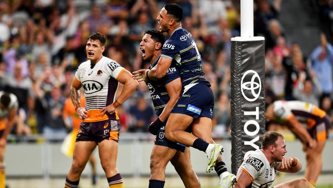 Valentine Holmes celebrates with Jason Taumalolo after the Cowboys' wrecking ball scored the final try of the match. Picture: Alix Sweeney