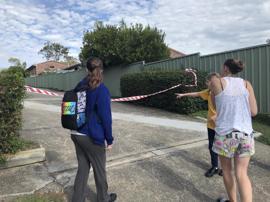 Residents at the scene of a fatal fire in Woodridge. Picture: Judith Kerr