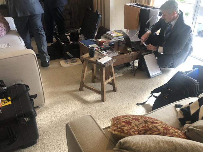 Federal police going through Annika Smethurst’s home in June last year. Picture: Supplied