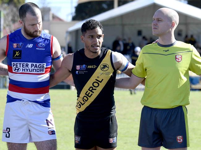 14/8/21 - SANFL game between Glenelg and Central District at Glenelg Oval. Marlon Motlop speaks to players in a huddle before the start of the game. Picture: Naomi Jellicoe