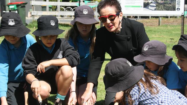 City of Sydney Lord Mayor Clover Moore breaks ground at Wimbo Park, Surry Hills, with children from Bourke Street Public School. Picture: Alexi Demetriadi