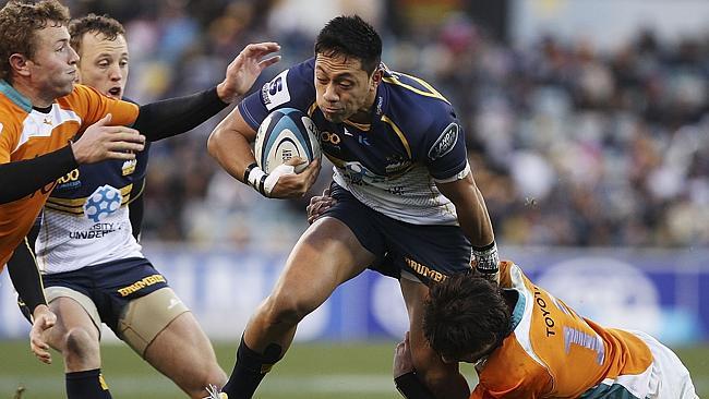 CANBERRA, AUSTRALIA - JULY 21: Christian Lealiifano of the Brumbies is tackled during the Super Rugby Qualifying Final match between the Brumbies and the Cheetahs at Canberra Stadium on July 21, 2013 in Canberra, Australia. (Photo by Stefan Postles/Getty Images)