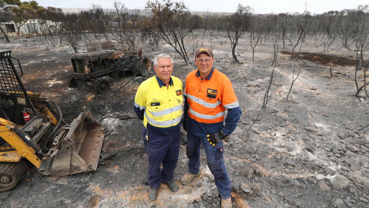 Father and son firefighters David and Davin Bryant at a relative’s property. Picture: Tait Schmaal