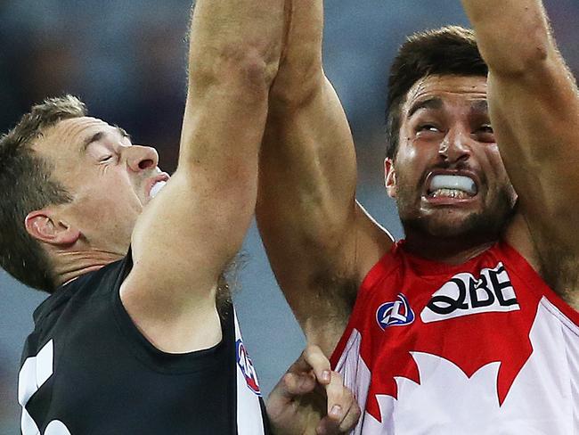 Sydney Swans' Tom Derickx and Collingwood's Nick Maxwell during AFL match Sydney Swans v Collingwood Magpies at ANZ Stadium. pic. Phil Hillyard