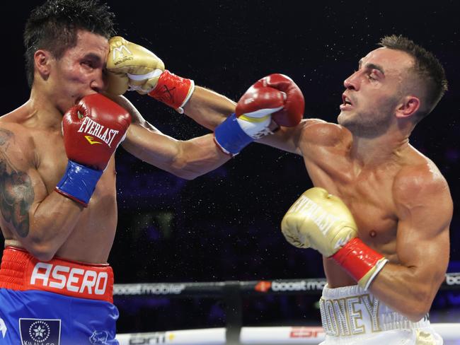 Moloney (R) lands a right hand on Astrolabio. Picture: Mikey Williams/Top Rank Inc via Getty Images