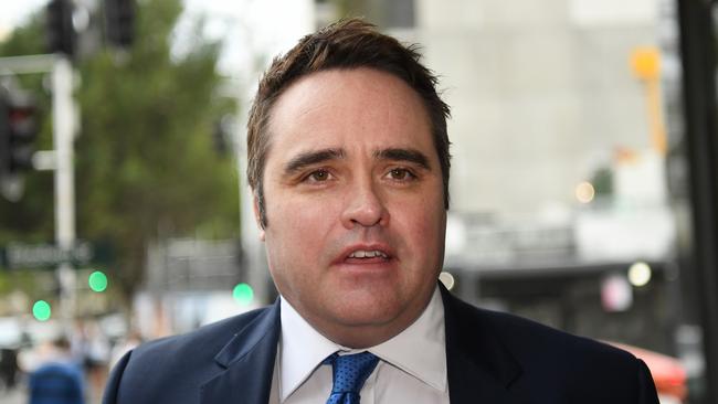 Former journalist Ben McCormack, arrives to the Downing Centre court in Sydney, Friday, October 6, 2017. McCormack last week pleaded guilty to two counts of using a carriage service to transmit, publish or promote child pornography after a new agreed statement of facts was presented to a Sydney court. (AAP Image/David Moir) NO ARCHIVING