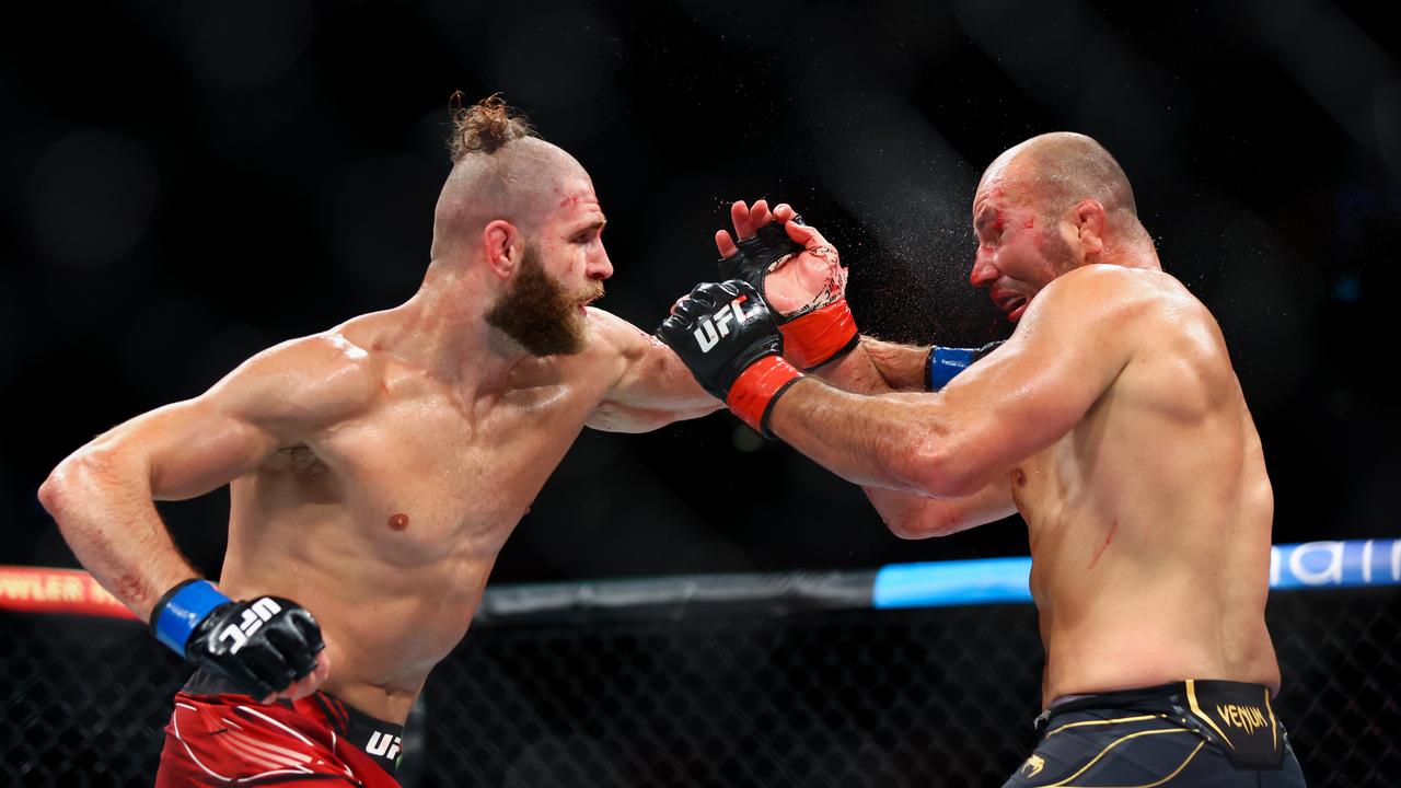 Jiri Prochazka and Glover Teixeira exchange strikes during their UFC275 light heavyweight title fight in June.