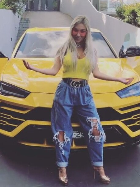 Nissy Nassif with a bright yellow Lamborghini Jean bought her. Picture: Instagram