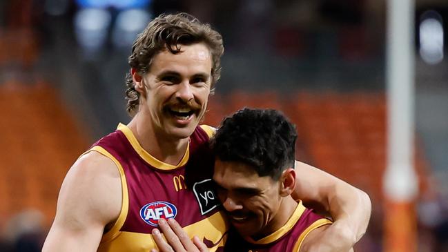 SYDNEY, AUSTRALIA - SEPTEMBER 14: Joe Daniher and Charlie Cameron of the Lions celebrate during the 2024 AFL First Semi Final match between the GWS GIANTS and the Brisbane Lions at ENGIE Stadium on September 14, 2024 in Sydney, Australia. (Photo by Dylan Burns/AFL Photos via Getty Images)