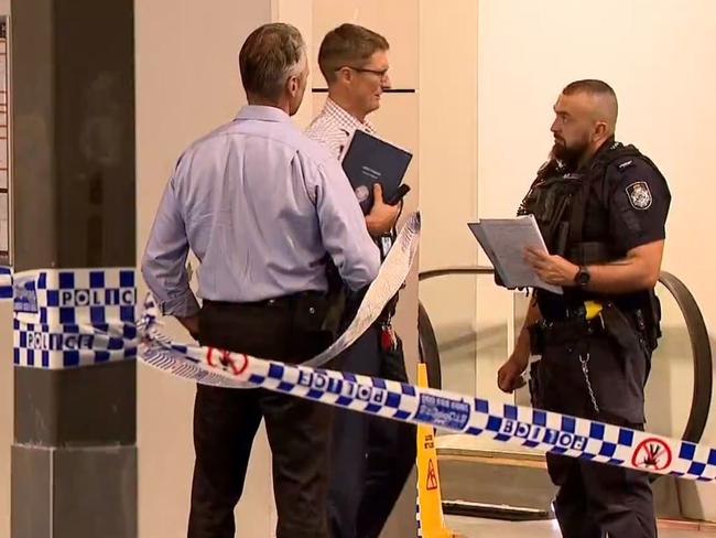 Police blocked the escalators, located next to Aldi, to the car park Saturday night. Picture: 9 News Qld