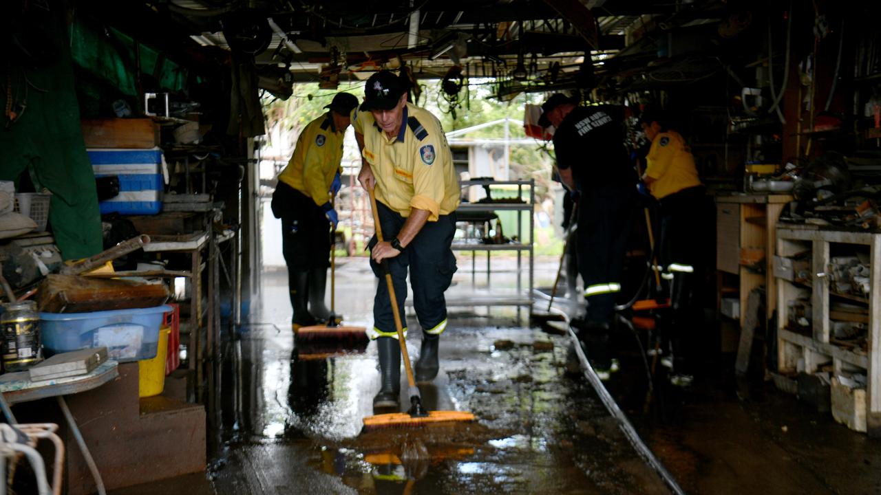 Wednesday February 13. Heavy rain causes flooding in North Queensland. Clean up after flooding in Ingham. Rural firefighters from southern Queensland and NSW help clean up Pastor Joe Marolla's home in Skinner Street. Picture: Evan Morgan