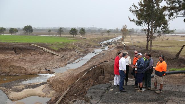 Labor MP Jason Clare, Federal Member for Macquarie Susan Templeman and Senator Katie Gallagher, speaking with cattle farmer Emanuel Degabriele and other farmers, as they visit a turf farm in Cornwallice outside Richmond which was affected by floods. Picture: Tim Hunter.