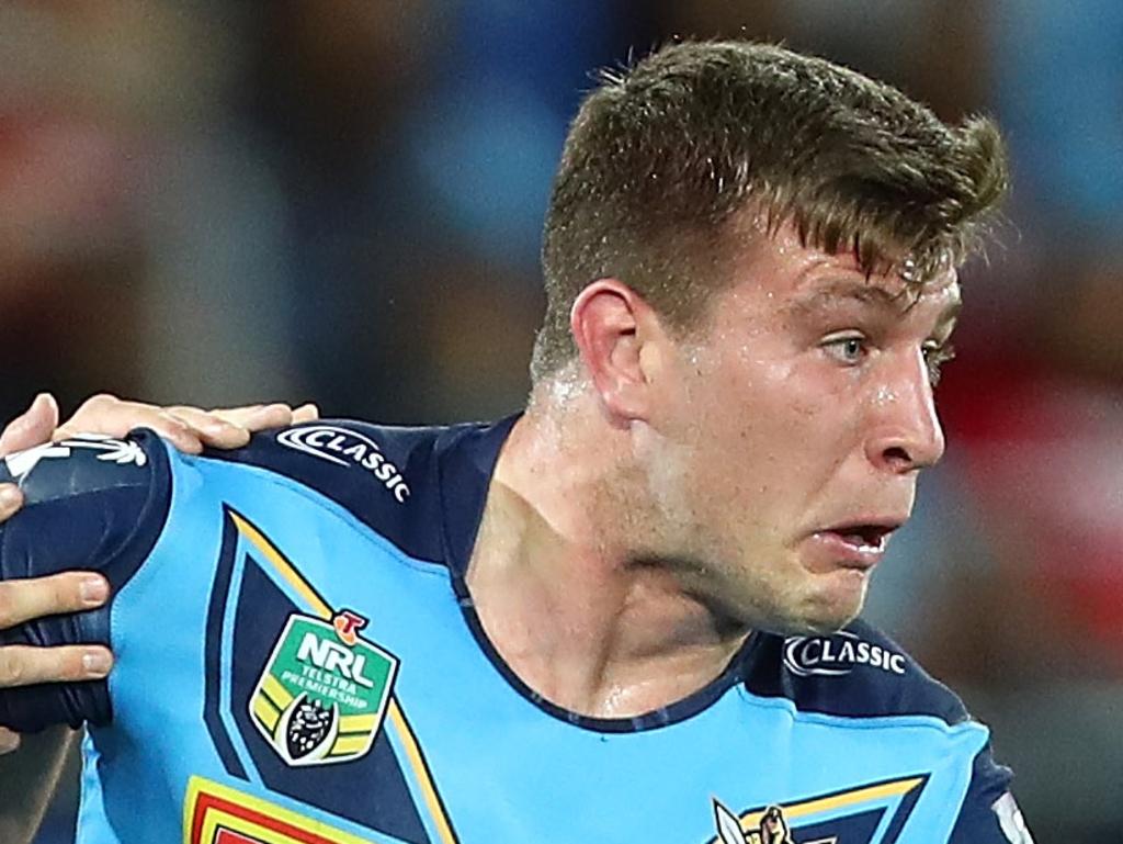 GOLD COAST, AUSTRALIA - AUGUST 25:  Jai Arrow of the Titans is tackled during the round 24 NRL match between the Gold Coast Titans and the Melbourne Storm at Cbus Super Stadium on August 25, 2018 in Gold Coast, Australia.  (Photo by Chris Hyde/Getty Images)