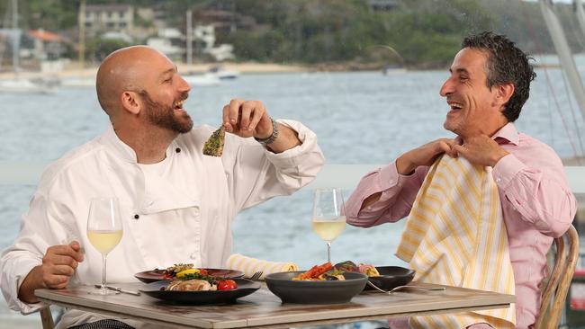 (l to r) Owner and executive chef Michel Rossetti and Ray Finocchiaro at the corner of the balcony with some of his from Cala Luna restaurant at The Middle Harbour Yacht Club at The Spit.