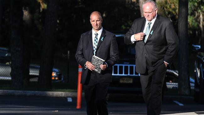 Gabby Petito's stepdad, Jim Schmidt (L), walks outside of a funeral home in Holbrook, New York.