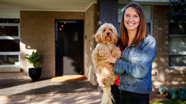 Property Investor Prue Muirhead at home with her dog Louie. Picture: Mike Burton