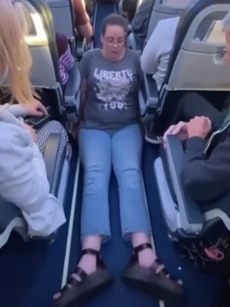 Jennie Berry shuffled her way down the aisle on her bottom. Picture: TikTok/wheelie_good_life