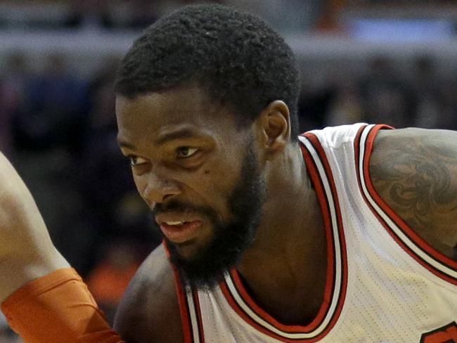 Chicago Bulls guard Aaron Brooks (0) drives against New York Knicks guard Shane Larkin (0) during the second half of an NBA basketball game in Chicago on Thursday, Dec. 18, 2014. The Bulls won 103-97. (AP Photo/Nam Y. Huh)