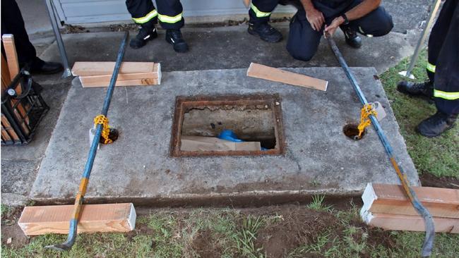 Police work to remove the lid of the septic tank containing the remains of Wayne Youngkin in North Road, Brighton in November 2016.