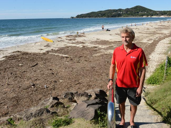 Byron Bay lifeguard supervisor Steve Mills at Main Beach Byron Bay. Erosion has impacted the shoreline from Main Beach to Clarkes Beach. The beaches have been closed and debris is strewn along what remains of the sand.