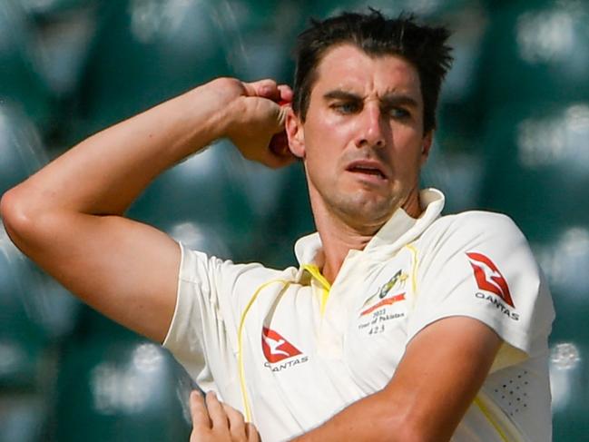 Australia's captain Pat Cummins delivers a ball during the second day of the third cricket Test match between Pakistan and Australia at the Gaddafi Cricket Stadium in Lahore on March 22, 2022. (Photo by Aamir QURESHI / AFP)