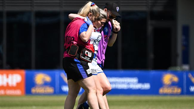 Kirsten McLeod is helped from the field. Picture: Daniel Carson/AFL Photos via Getty Images