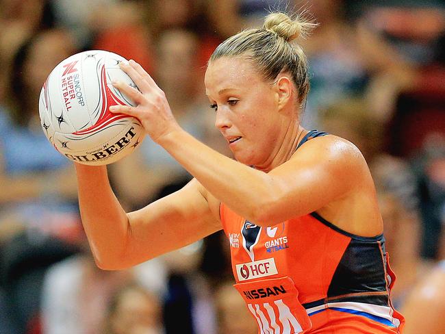 Kim Green of the Giants takes a pass as she is challenged by The Swifts Abby McCulloch during the Giants v Swifts netball season opener at the Sydney Olympic Park Sports Centre. pic Mark Evans