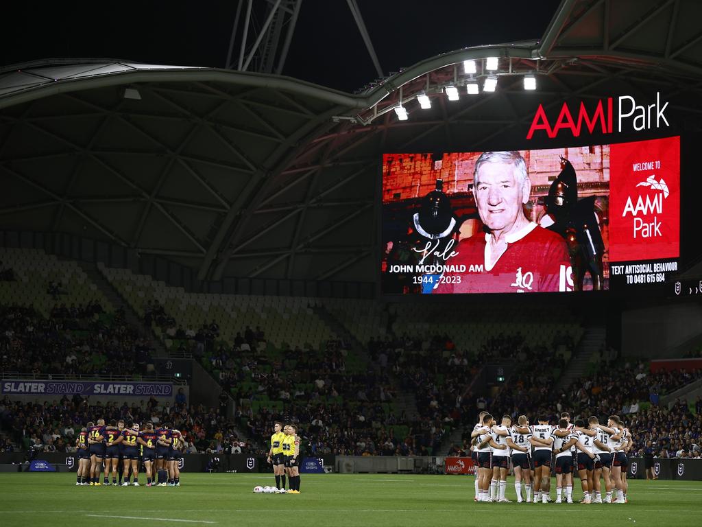 Players from both team pay their respects to former player John McDonald. (Photo by Daniel Pockett/Getty Images)