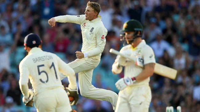 Joe Root takes the wicket of Matthew Wade. Picture: Getty Images