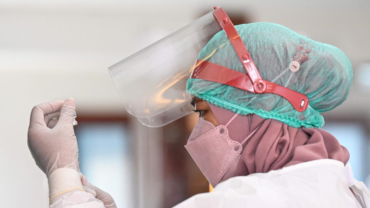 A nurse prepares a booster dose of the Pfizer Covid-19 vaccine. Picture: AFP.