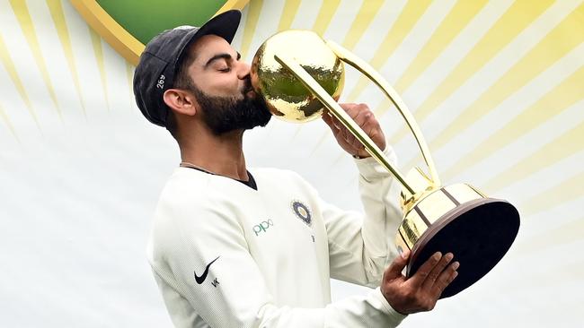 India's captain Virat Kohli kisses the Border-Gavaskar trophy after his country’s first ever series win in Australia in 2019 Picture: AFP