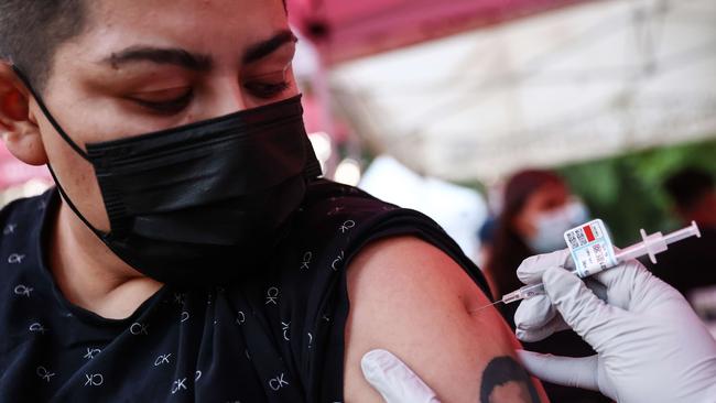 A person receives a COVID-19 vaccination dose in Los Angeles, California. Picture AFP