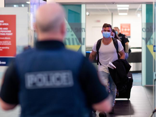 Two flights arriving to Darwin have been quarantined after the Northern Territory has once more closed its borders to South Australia. Passengers were in the air when the decision was made. QF860 and JQ692 arrived at Darwin Airport and passengers were given the option to return to Adelaide or quarantine for two weeks in Howard Springs. Picture: Che Chorley