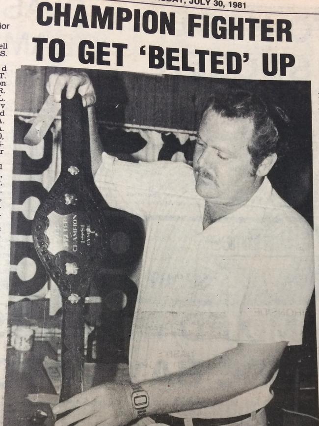Fight promoter Colin Hose holds up the finely crafted championship belt in July 30, 1981.