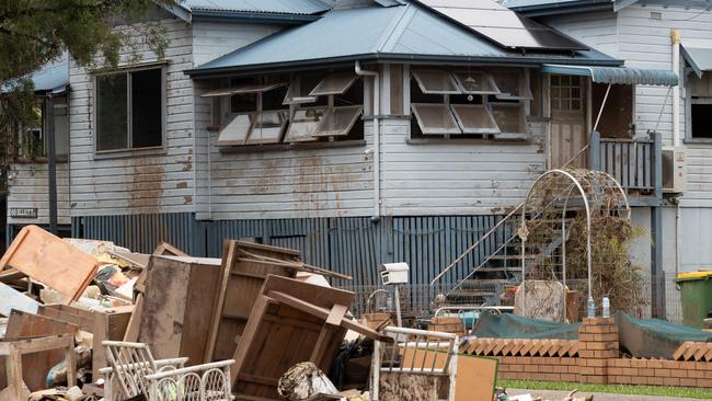 Flood damaged items piled out front of a house in Lismore in March this year. Picture: NCA NewsWire/Danielle Smith