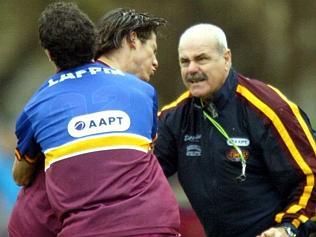 Nigel Lappin gets a handpass away as Shane O'Bree put pressure on. 2003 Grand Final. Collingwood v Brisbane Lions. MCG.