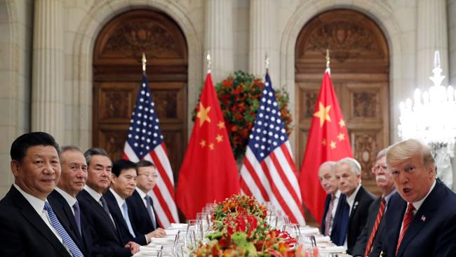 Donald Trump, John Bolton and Chinese President Xi Jinping attend a working dinner after the G20 leaders summit in Buenos Aires in 2018.