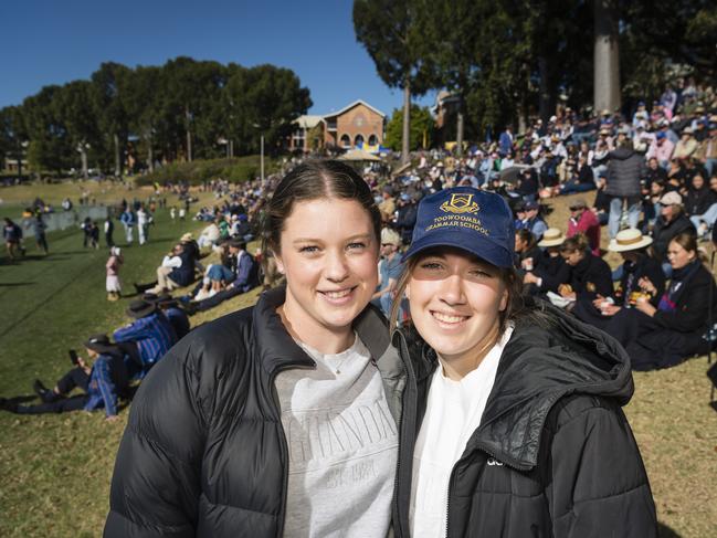 Rosie Duggan (left) and Ella Richardson support TGS on Grammar Downlands Day at Toowoomba Grammar School, Saturday, August 19, 2023. Picture: Kevin Farmer