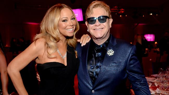 Pictured here last year, Mariah and Elton got paid big bucks to perform a wedding gig on the weekend. Picture: Michael Kovac/Getty Images for EJAF