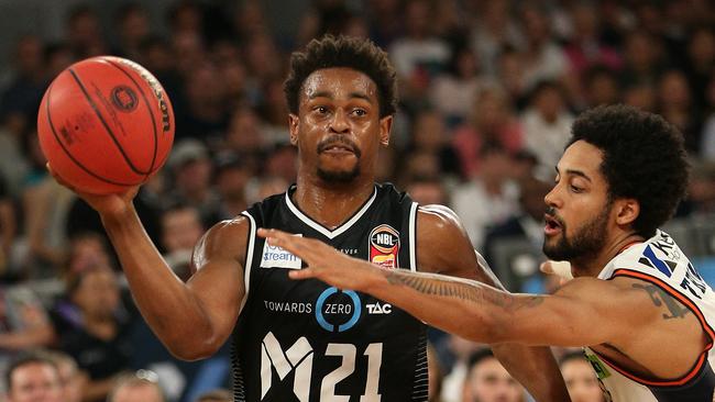 Casper Ware (left) shapes as a hard man to replace — but Melbourne think they have their man in Melo Trimble (right). Picture: AAP