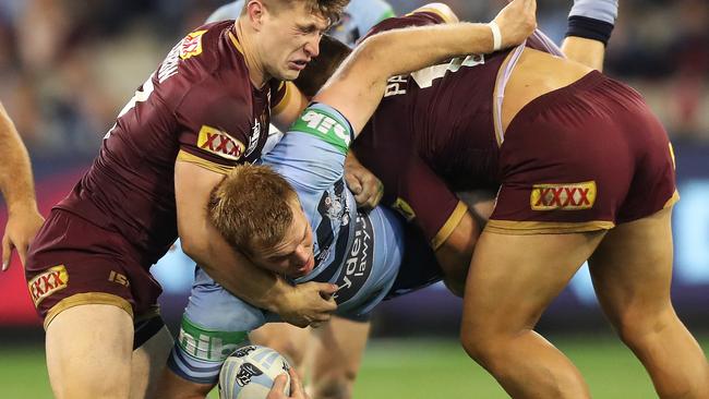 NSW's Jake Trbojevic being pounded in a heavy tackle. Picture: Brett Costello