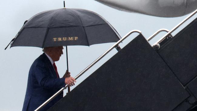 Trump climbs into his private plane to head back to Florida after pleading not guilty to the charges.