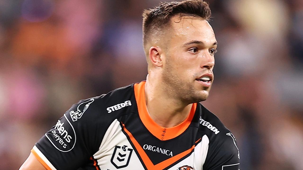 SYDNEY, AUSTRALIA - MARCH 12: Luke Brooks of the Tigers runs the ball during the round one NRL match between the Wests Tigers and the Melbourne Storm at CommBank Stadium, on March 12, 2022, in Sydney, Australia. (Photo by Mark Kolbe/Getty Images)