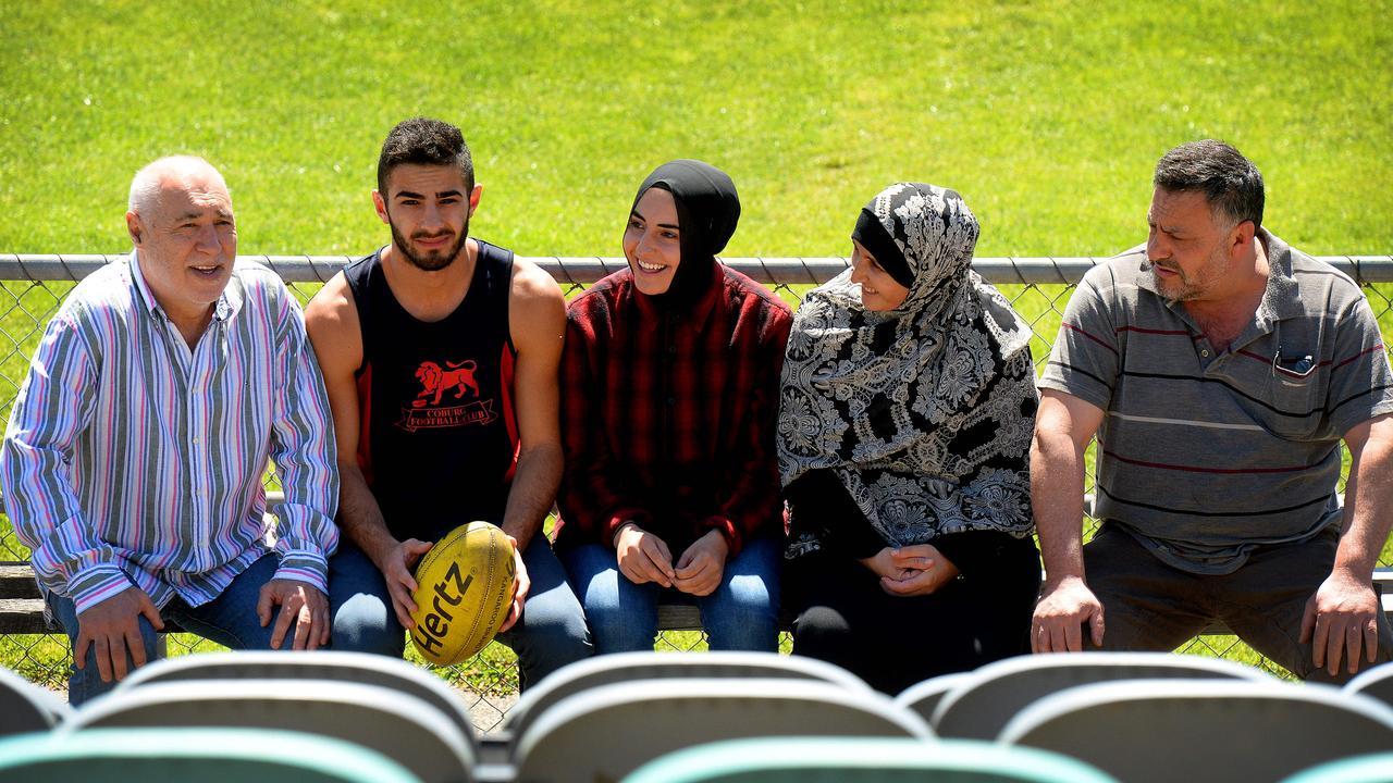 Phil Cleary with Adam Saad, sister Aicha, mother Nejma and father Zaf in 2014. Picture: Angie Basdekis